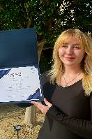Jenna Walker holding award