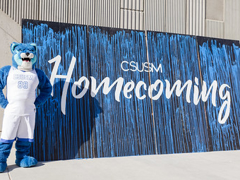crash with homecoming sign