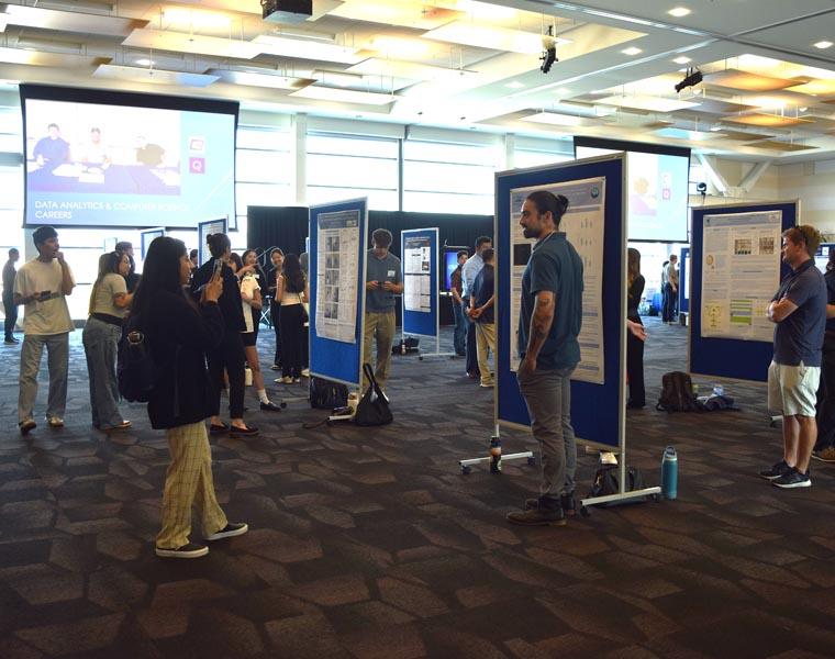 Student presenting their showcase board