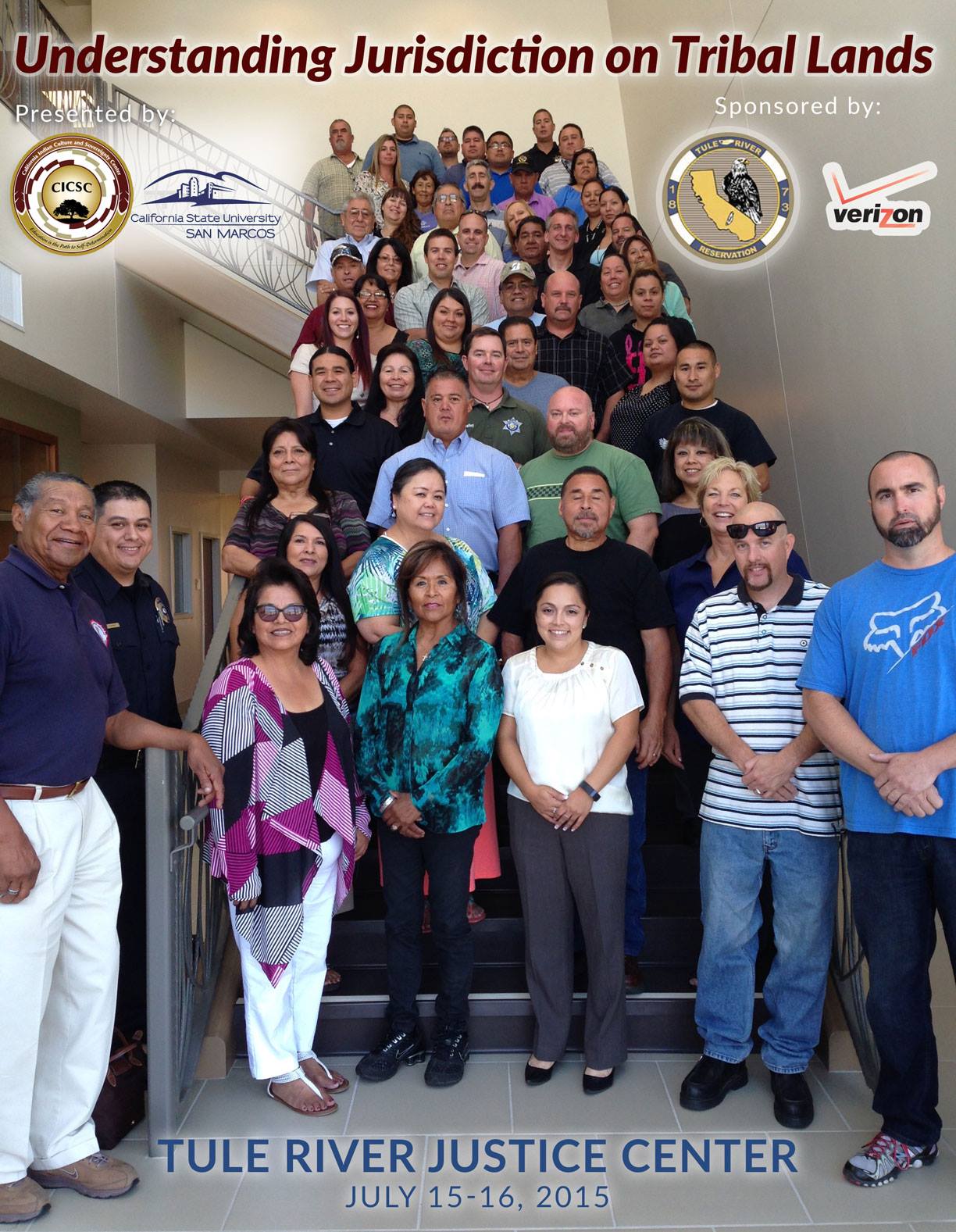 Program participants gathered in front of and up a staircase with the following information on the poster: Understanding Jurisdiction on Tribal Lands, Tule River Justice Center, July 15-16, 2015, Presented by: CICSC and California State University San Marcos, Sponsored by: Tule River Reservation and Verizon