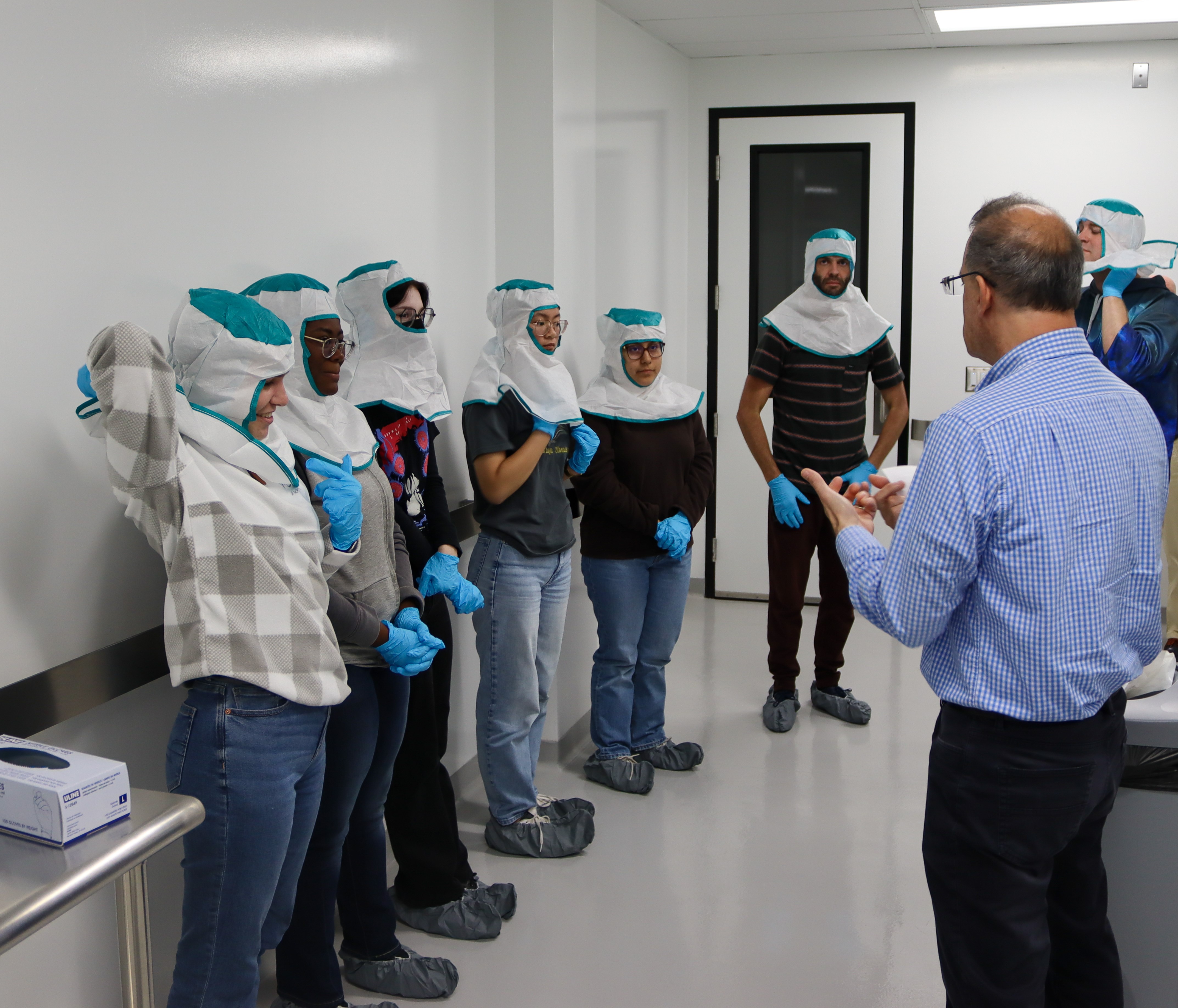 Interns in protective gear Interns in protective gear
