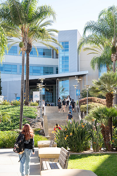 Students walking up to Markstein Hall