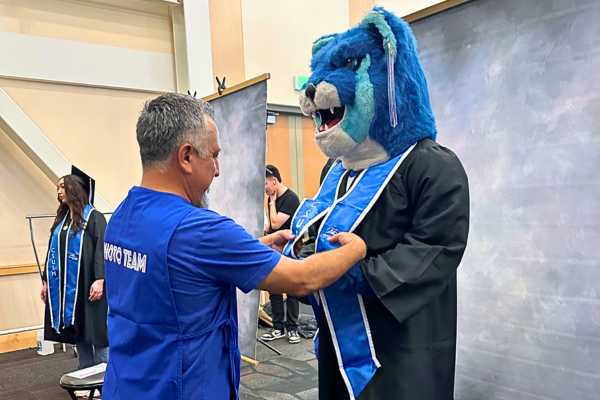 diFranco Photography Staff fixing Crash's regalia for portraits diFranco Photography