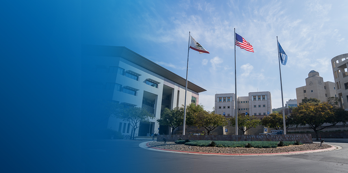 CSUSM entryway with the three flag poles