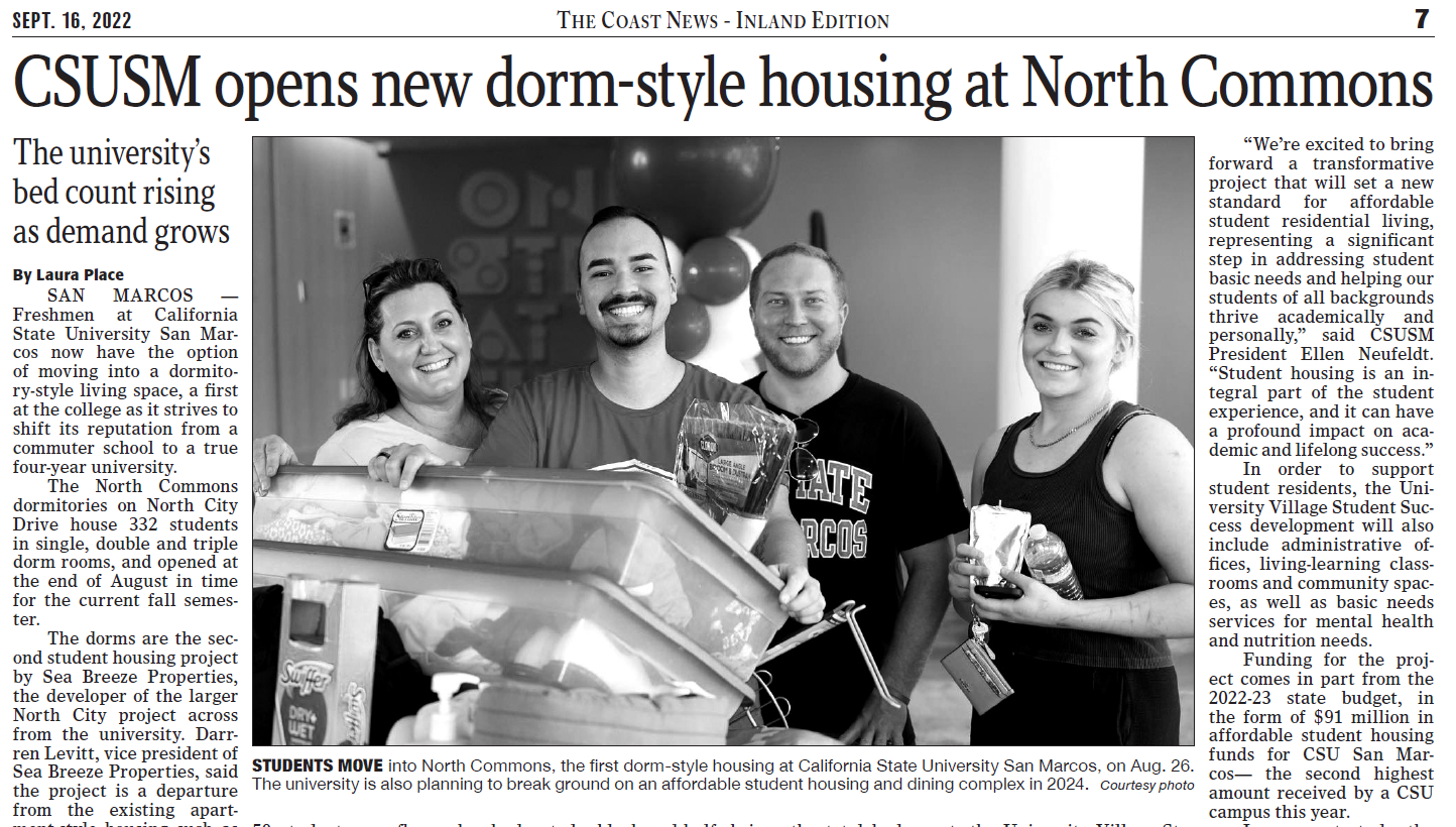 Newspaper story showing students moving into North Commons housing