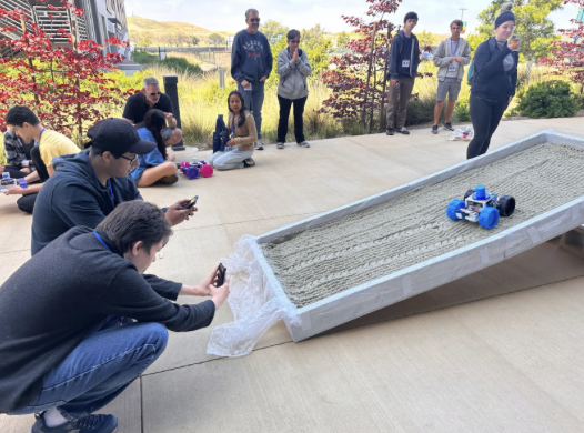 NASA academy students testing their rover on an incline slope