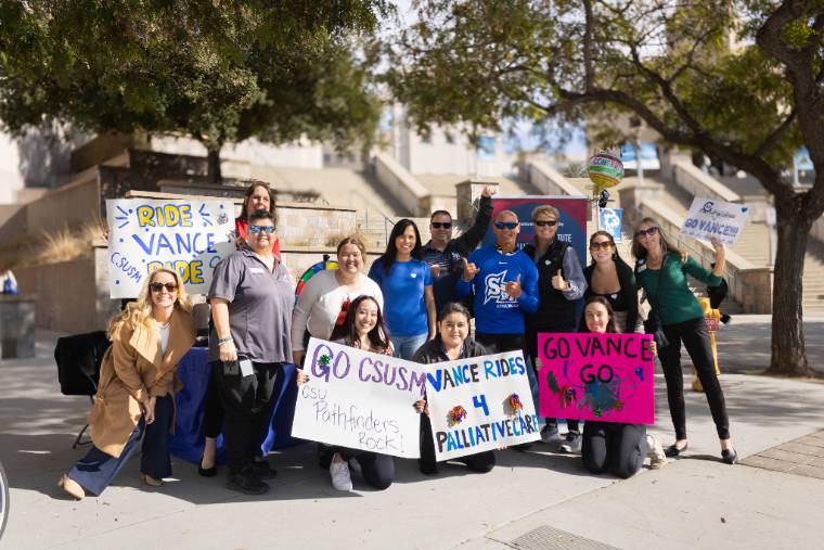 Students holding signs