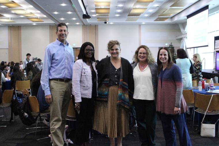 participants standing together for the IPE training and programming