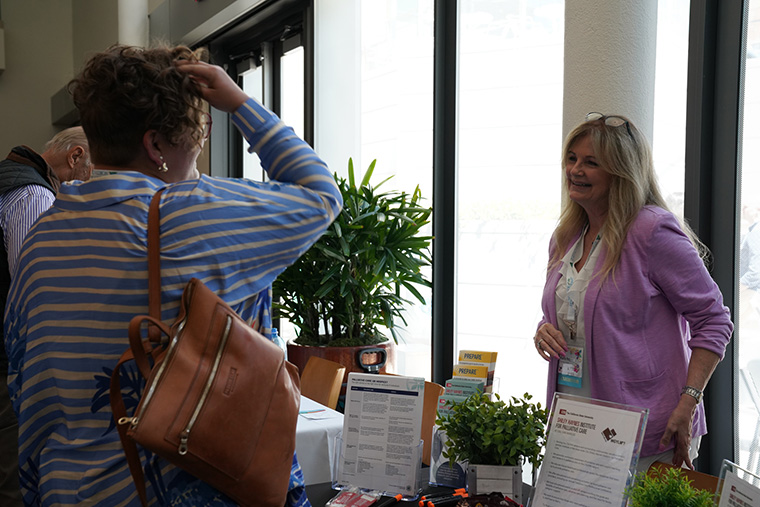 Participant speaking with a vendor