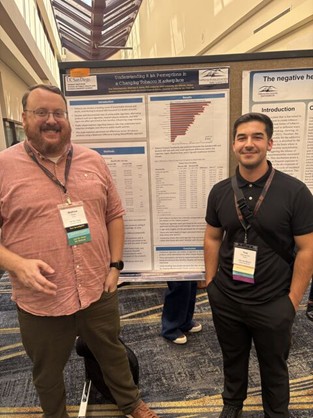 Poster_REACH Picture of research mentor and mentee in front of scientific poster