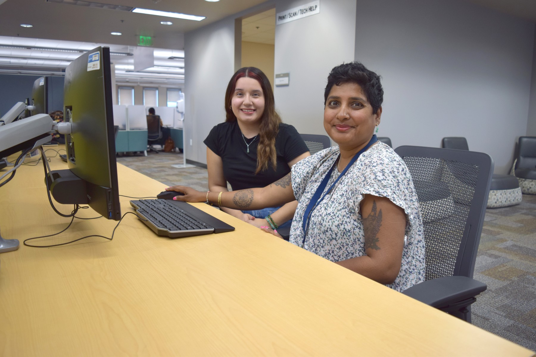 Social Sciences Librarian Lalitha Nataraj shows some of the University Library's new ethnic studies resources to student Graciela Gerardo.