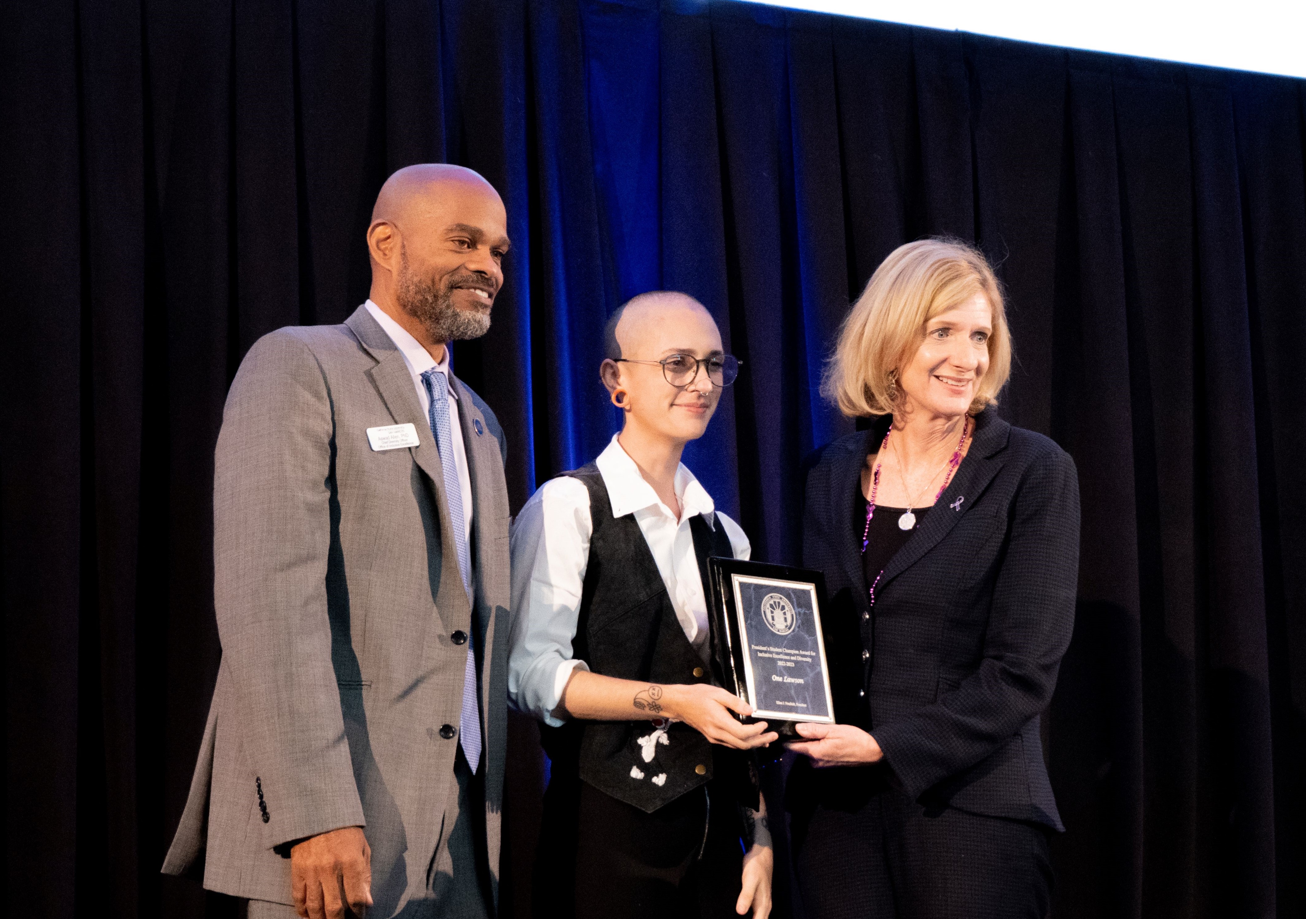 Chief Diversity Officer Aswad Allen pictued on left, One Reks, Student Campion Awardeepictured in the middle and President Ellen Neufelt pictured on the right