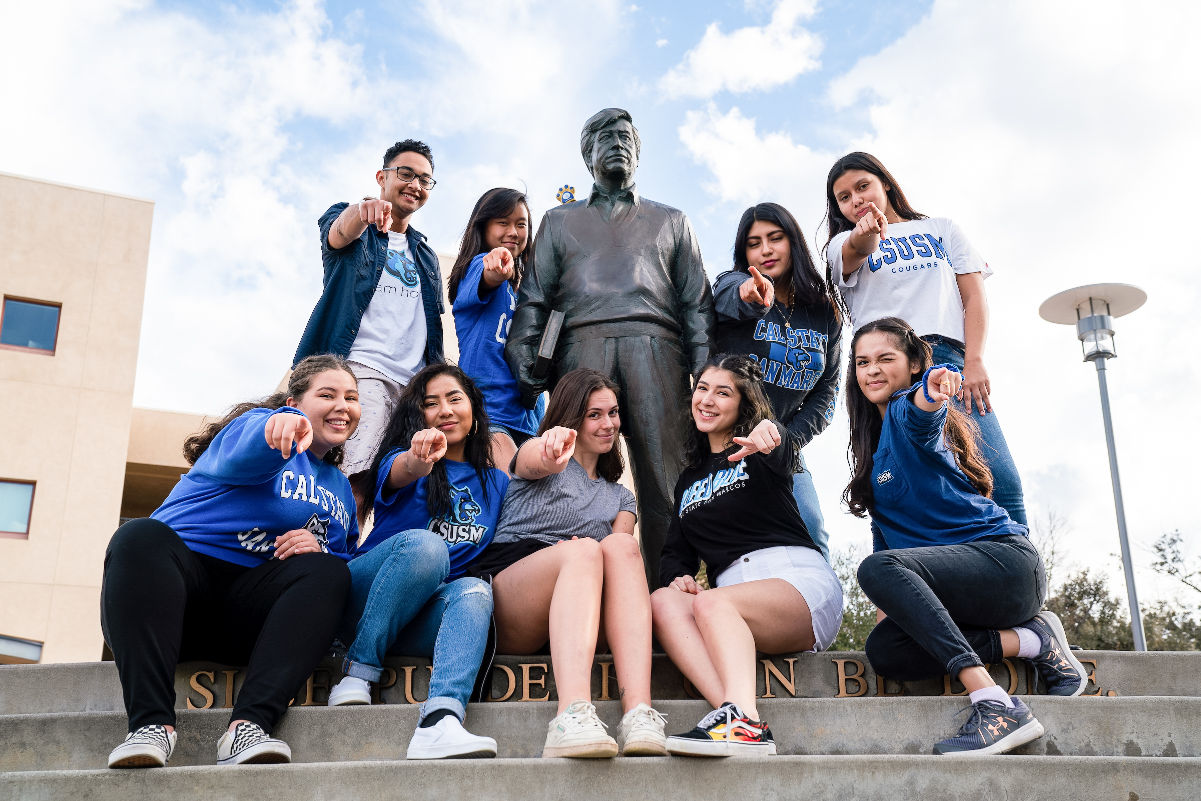 CSUSM students posing at the Cesar Chavez Circle on campus