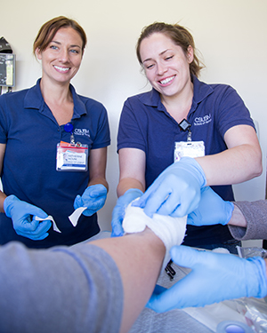 CSUSM nursing students working hands-on in the community.