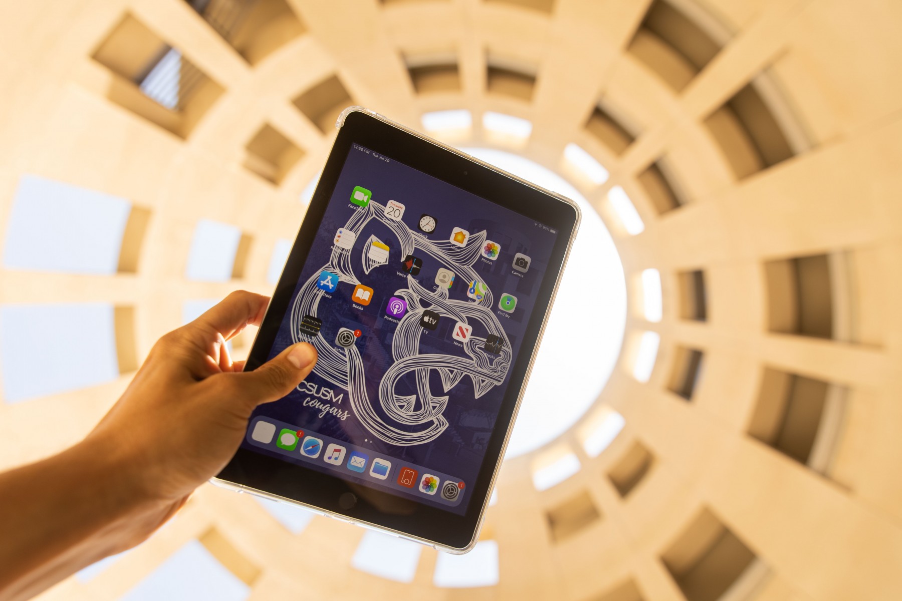 Hand holding an iPad in the rotunda