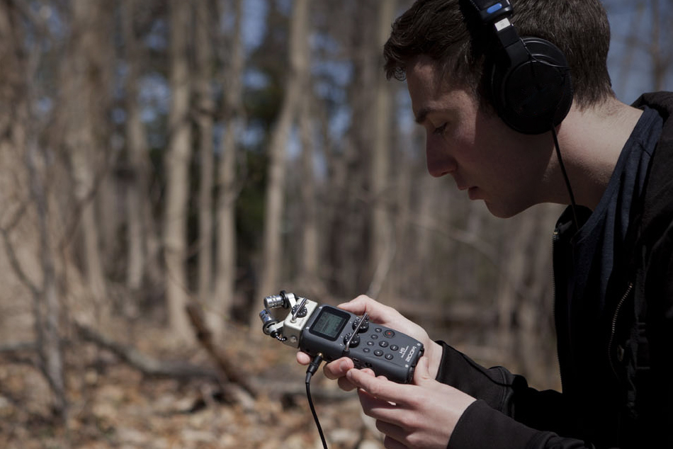 Man recording audio outdoors