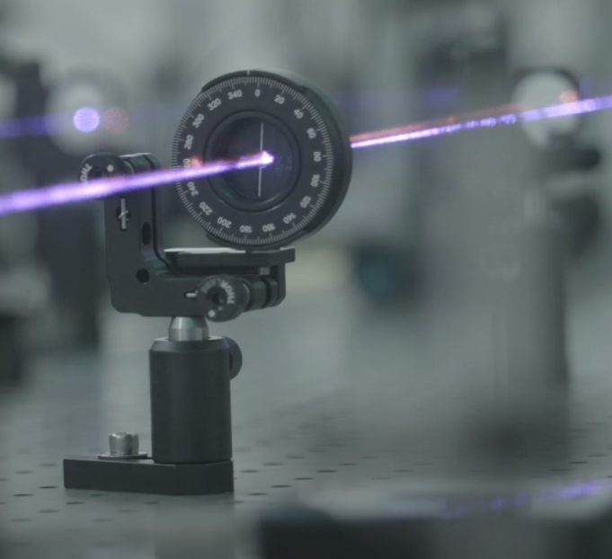 laser beam traveling through an optical element