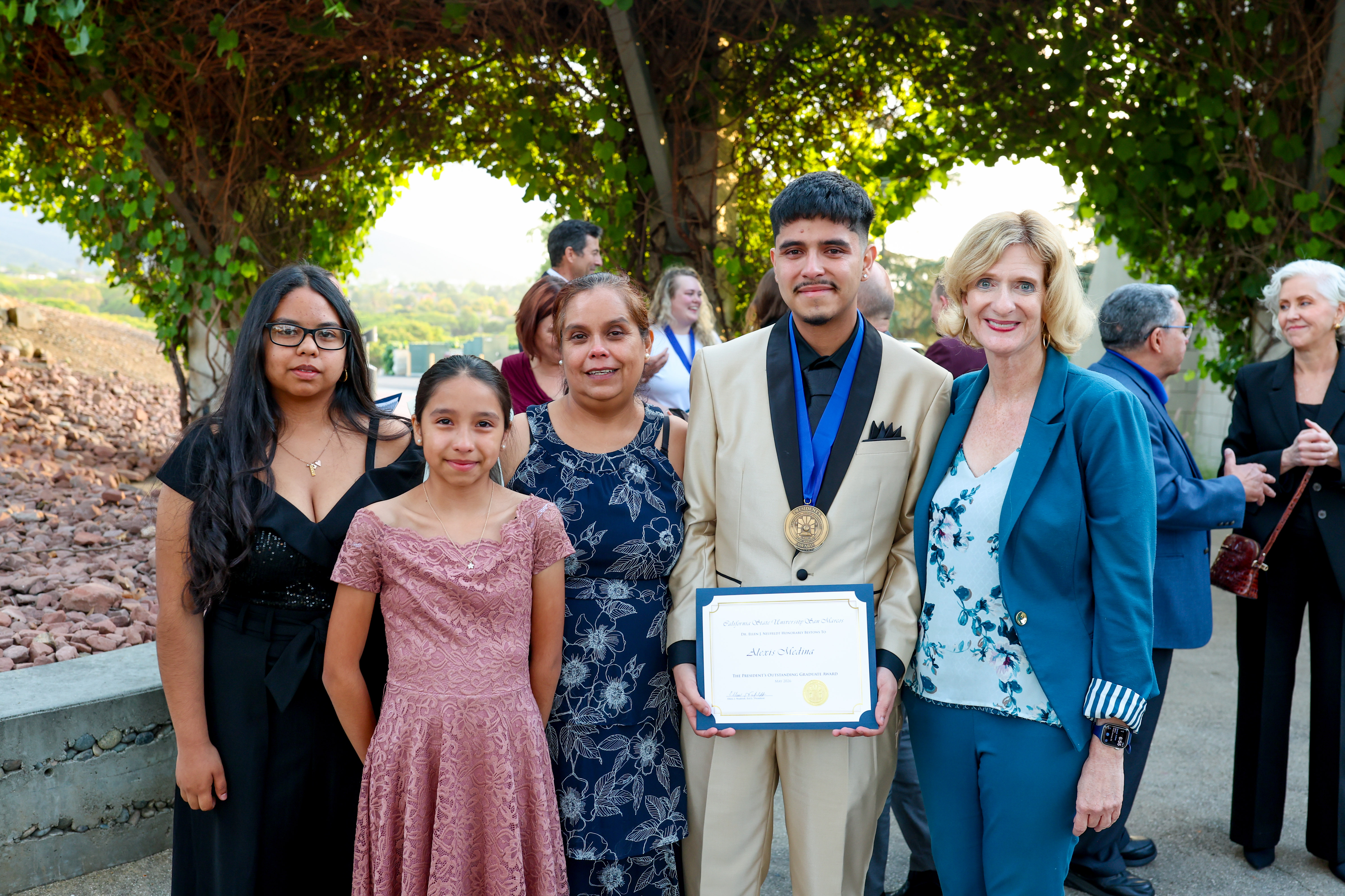 Alexis Medina and Family with President Neufeldt