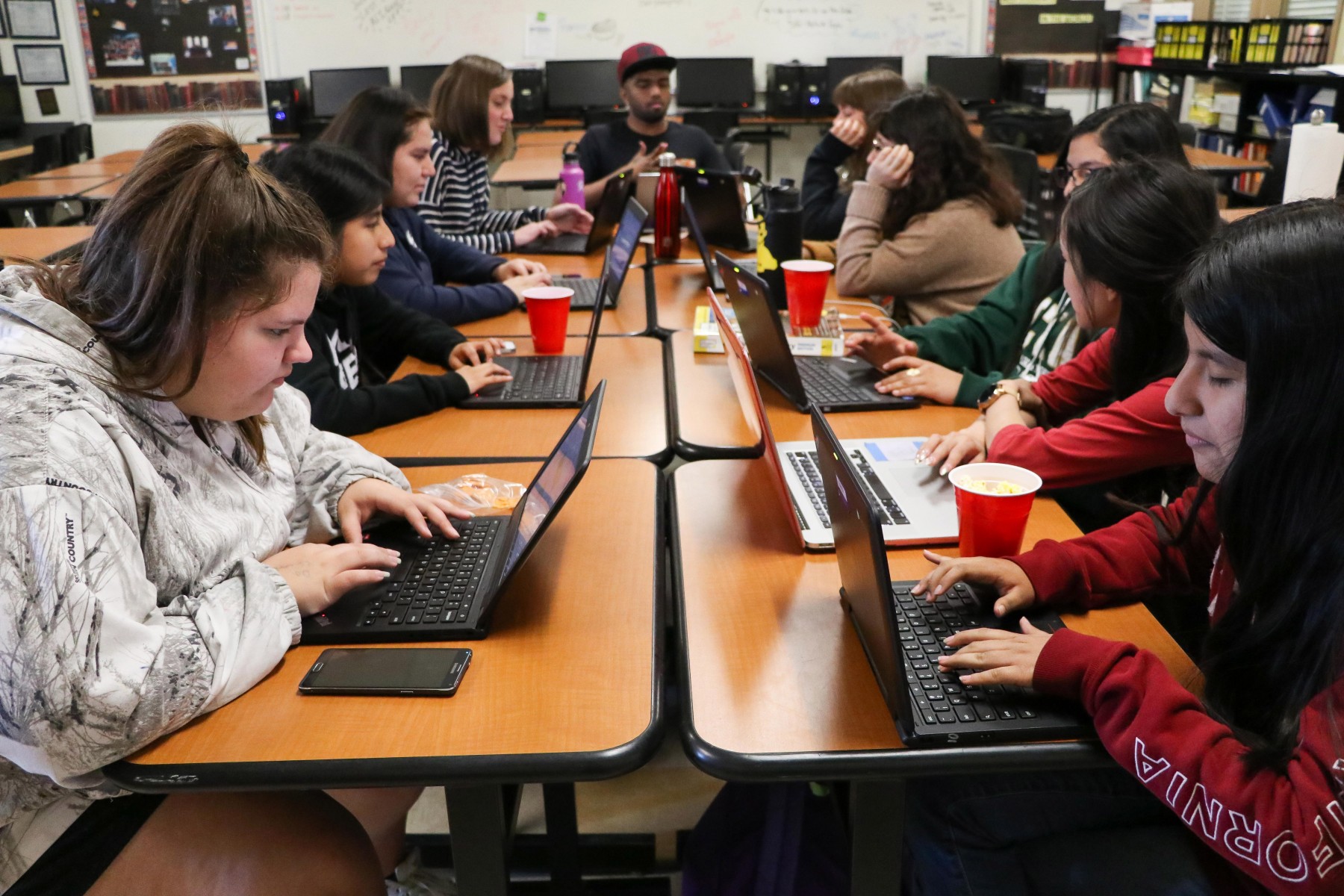 High School students coding in the CodeQueens club