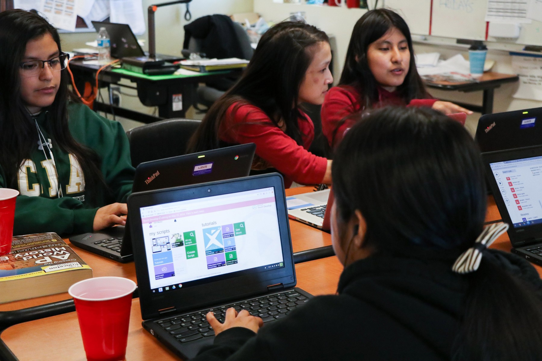 High School students coding in the CodeQueens club