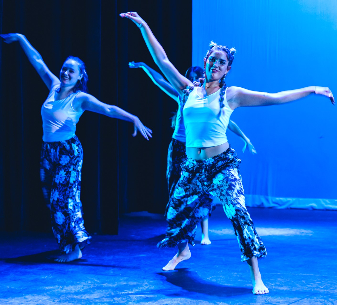 Students performing a dance pose. 
