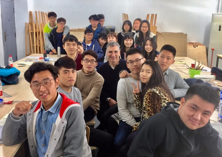 Professor in classroom with students in Anhui University, China
