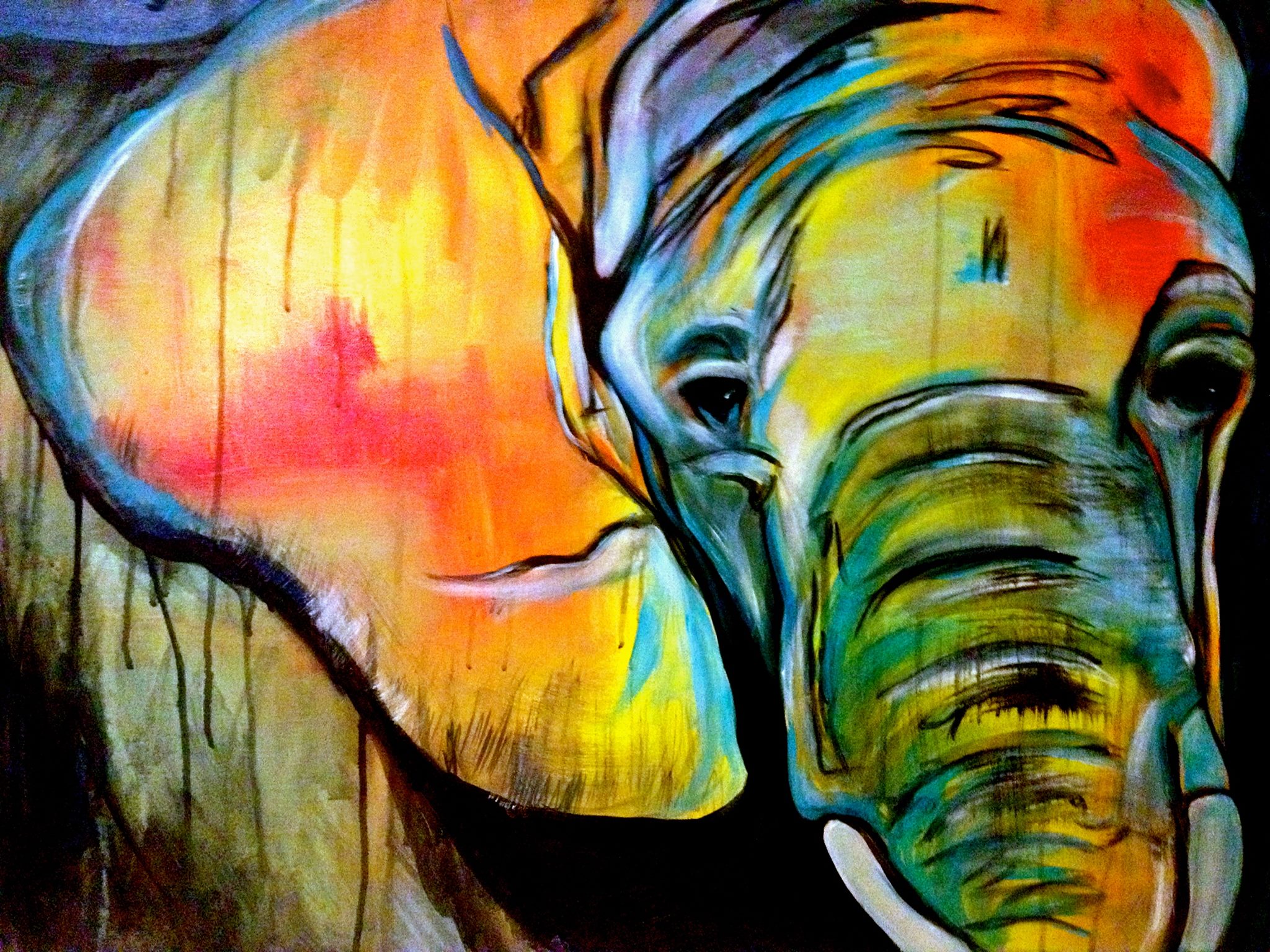 a colorful elephant with dripping paint.