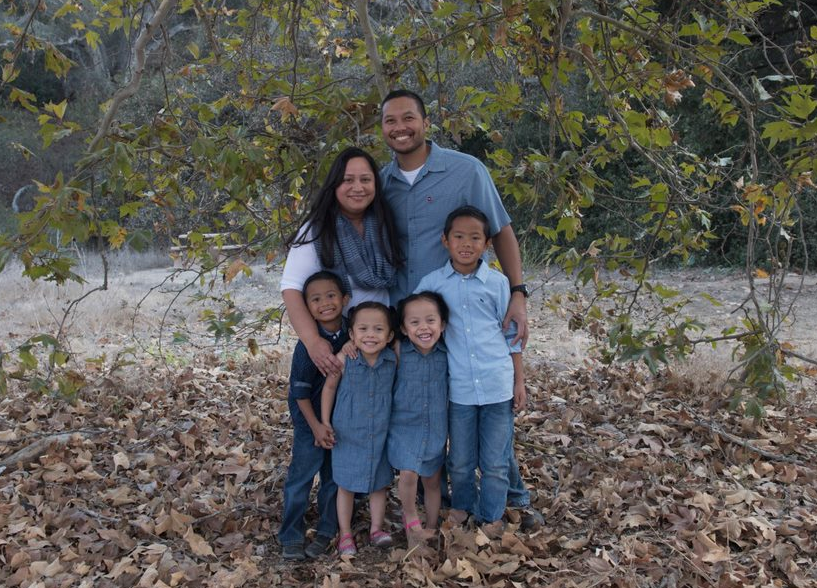Francis and her family outdoors.