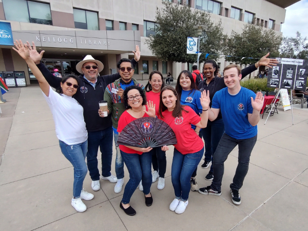 group of people in front of Kellogg Library
