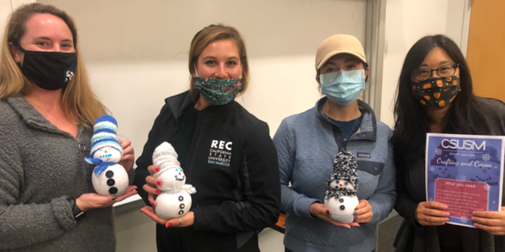 Staff with their snow people