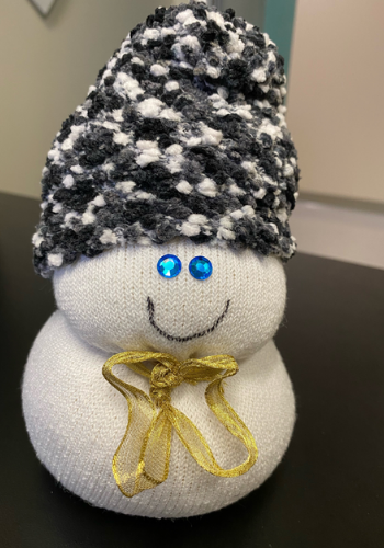 snowperson with a black and white hat