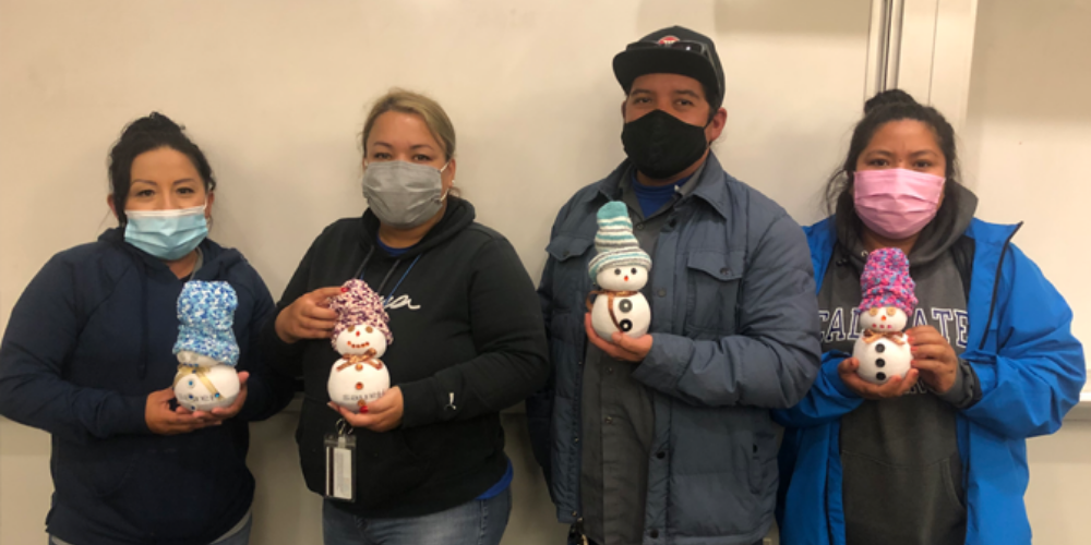 Staff with their snowpeople