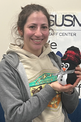 Staff with their crafted penguin
