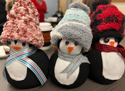 three crafted penguins