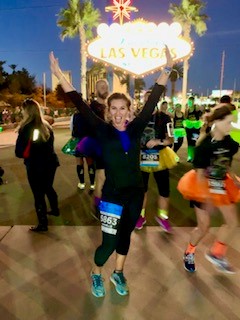 Dani celebrating completing a marathon.